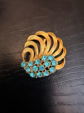 Vintage Gold Tone Blue Rhinestone Swirl Brooch
